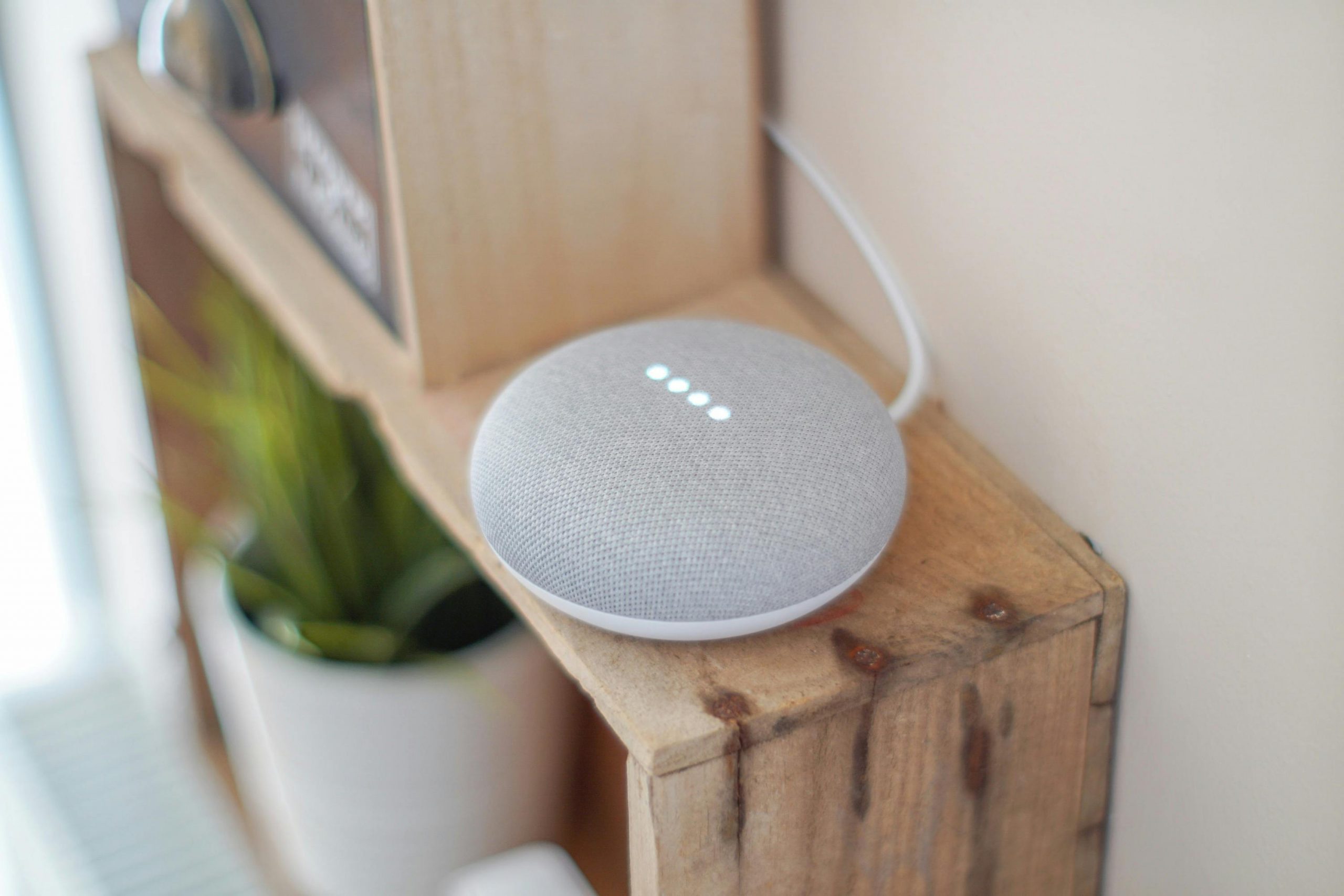 Google Home device on a bookcase