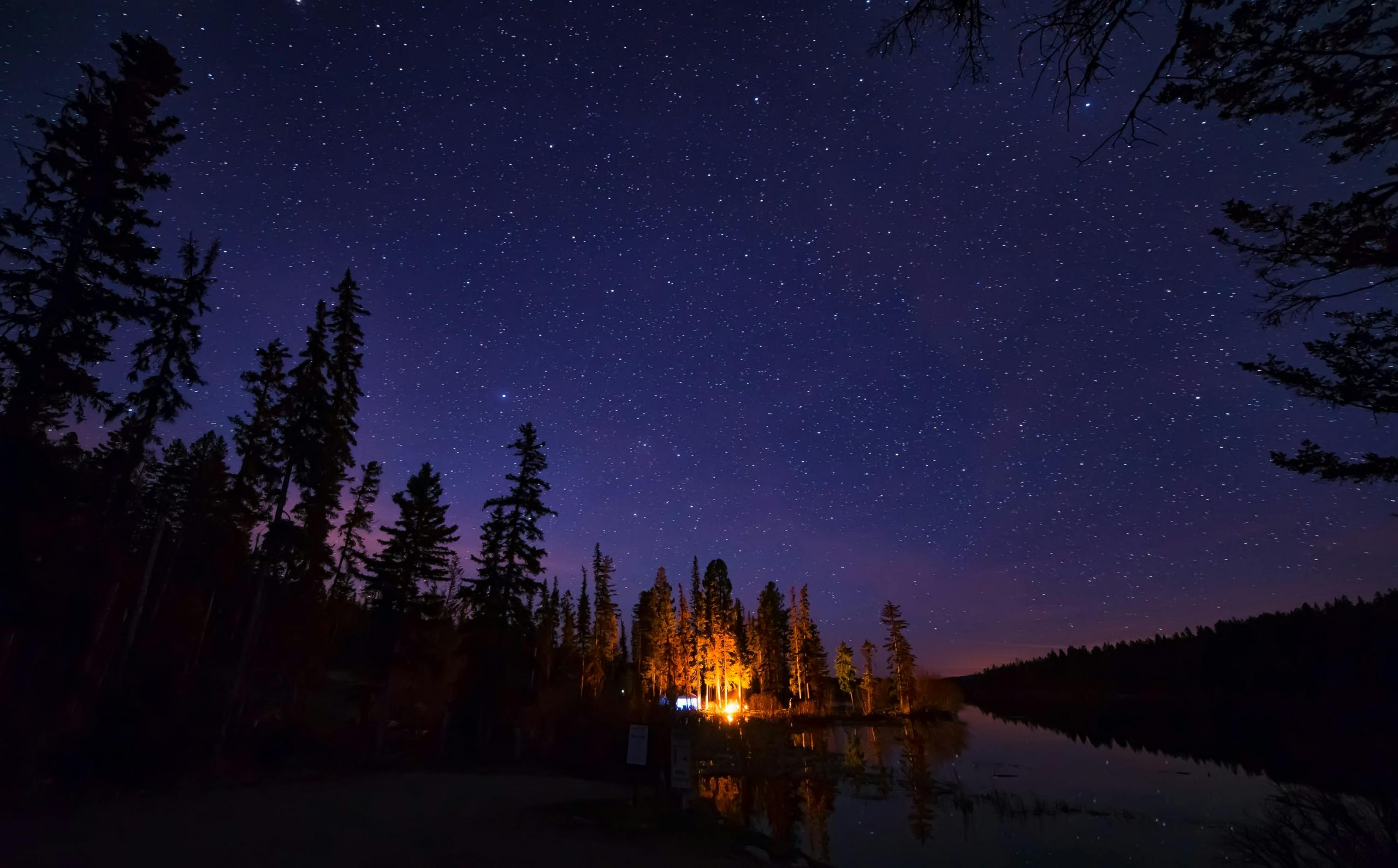 Lit up tent at night under the stars