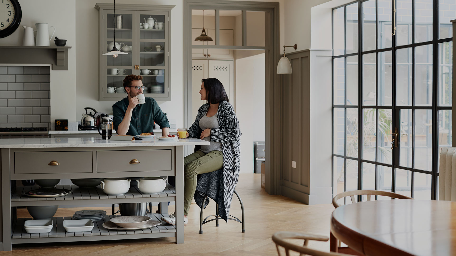 Couple sitting together in a kitchen